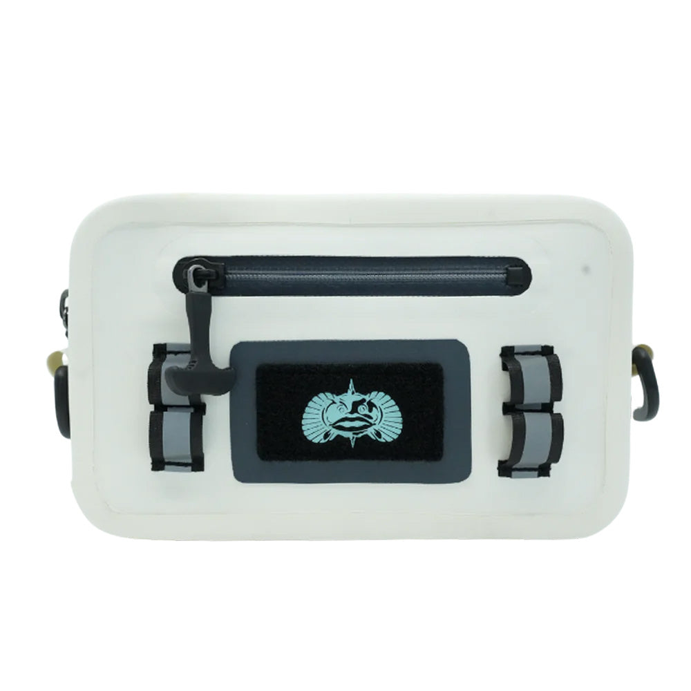 A sea shell colored waterproof sling bag with black straps and a Toadfish logo on the front. It has exterior latch loops and a Velcro fly patch.
