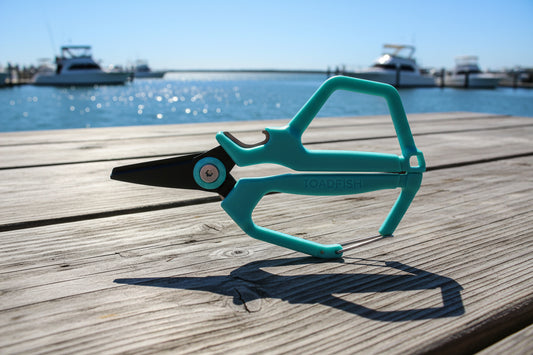 Turquoise garden shears with 'Toadfish' branding on a white background
